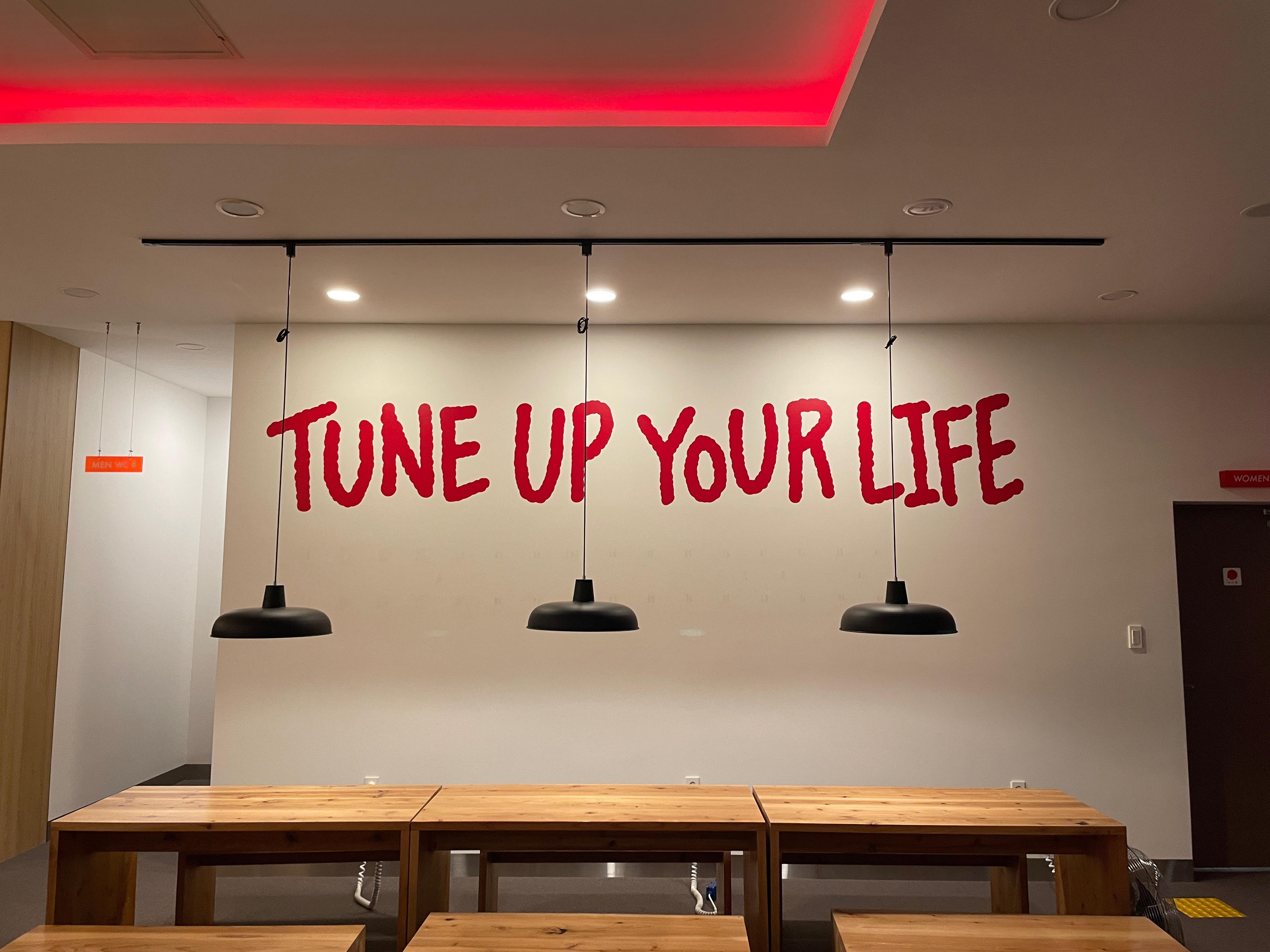 TUNE UP YOUR LIFE. The word 'TUNE' — borrowed from 'radio' — conveys 'tuning daily life and travel.' A memorable slogan.